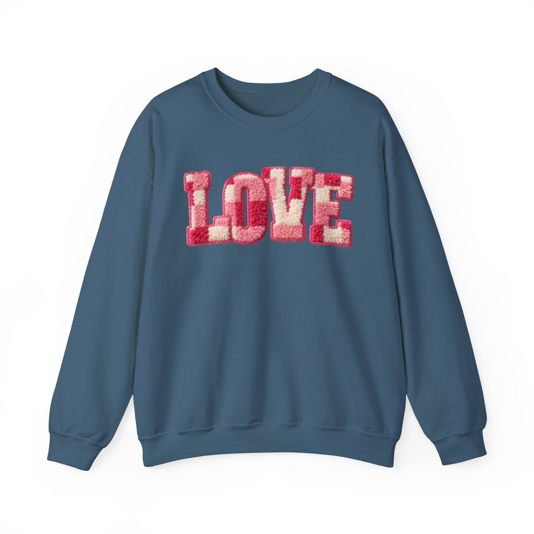 Blue crew-neck sweatshirt with LOVE in chunky pink, red, cream chenille letters, offering comfort with 50/50 cotton-polyester blend, ideal for casual wear.