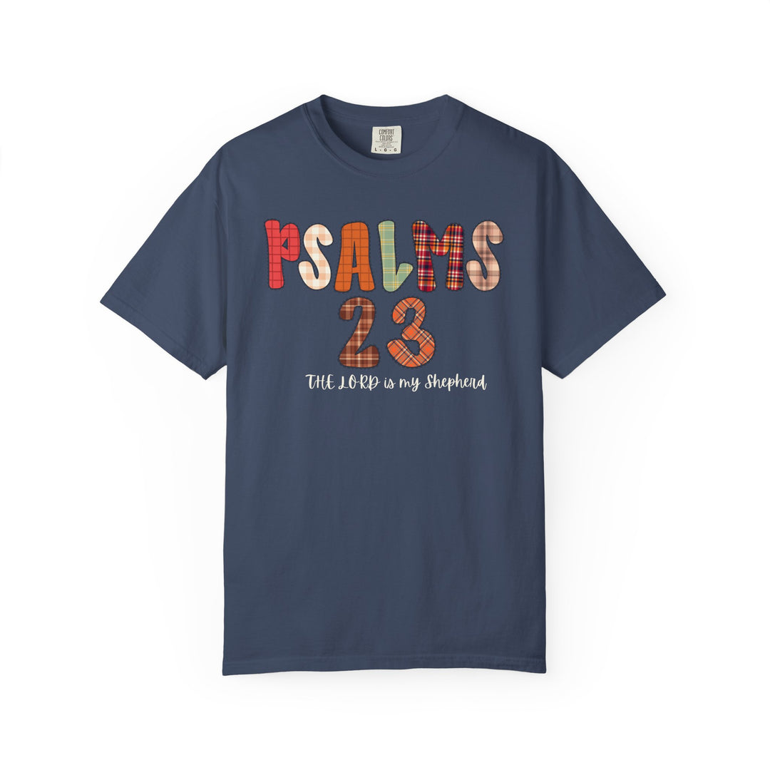 Navy-blue Psalms 23 Tee featuring patchwork-style letters and handwritten script, embodying comfort with a relaxed fit, ideal for faith-inspired casual wear.