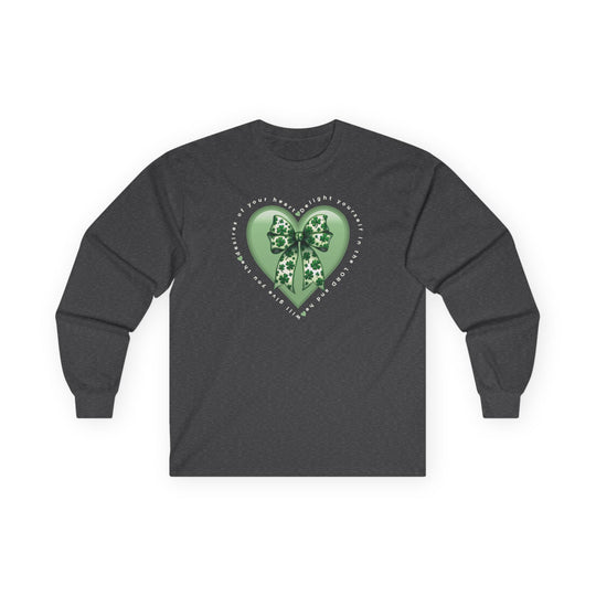 Delight in the Lord Long Sleeve Tee featuring a green heart with shamrock ribbon and inspirational text, laid flat, showcasing its classic fit and durable design.