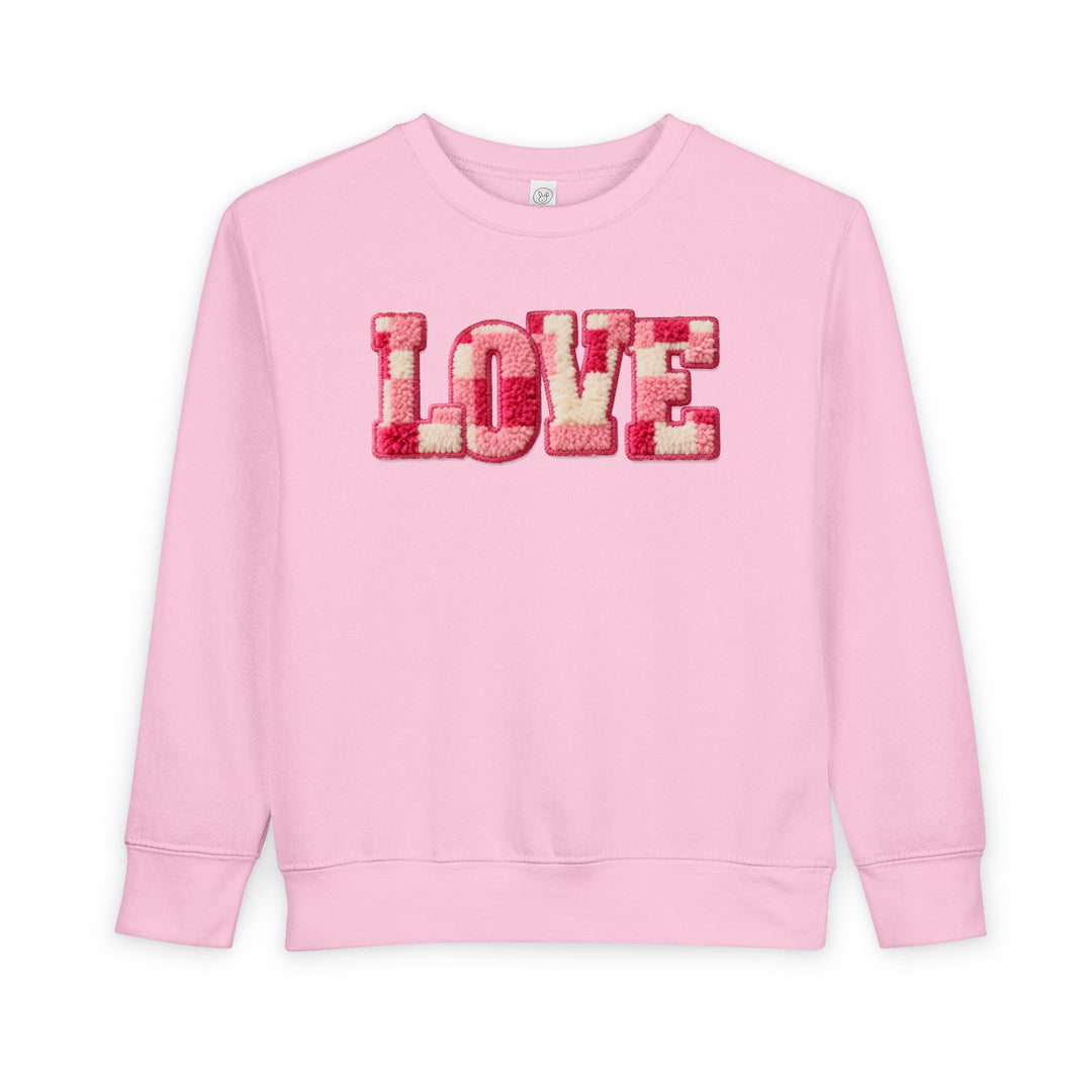 Light-pink Love Toddler Crew sweatshirt with chenille LOVE patch in pink, red, and cream shades, offering warmth and comfort for toddlers.