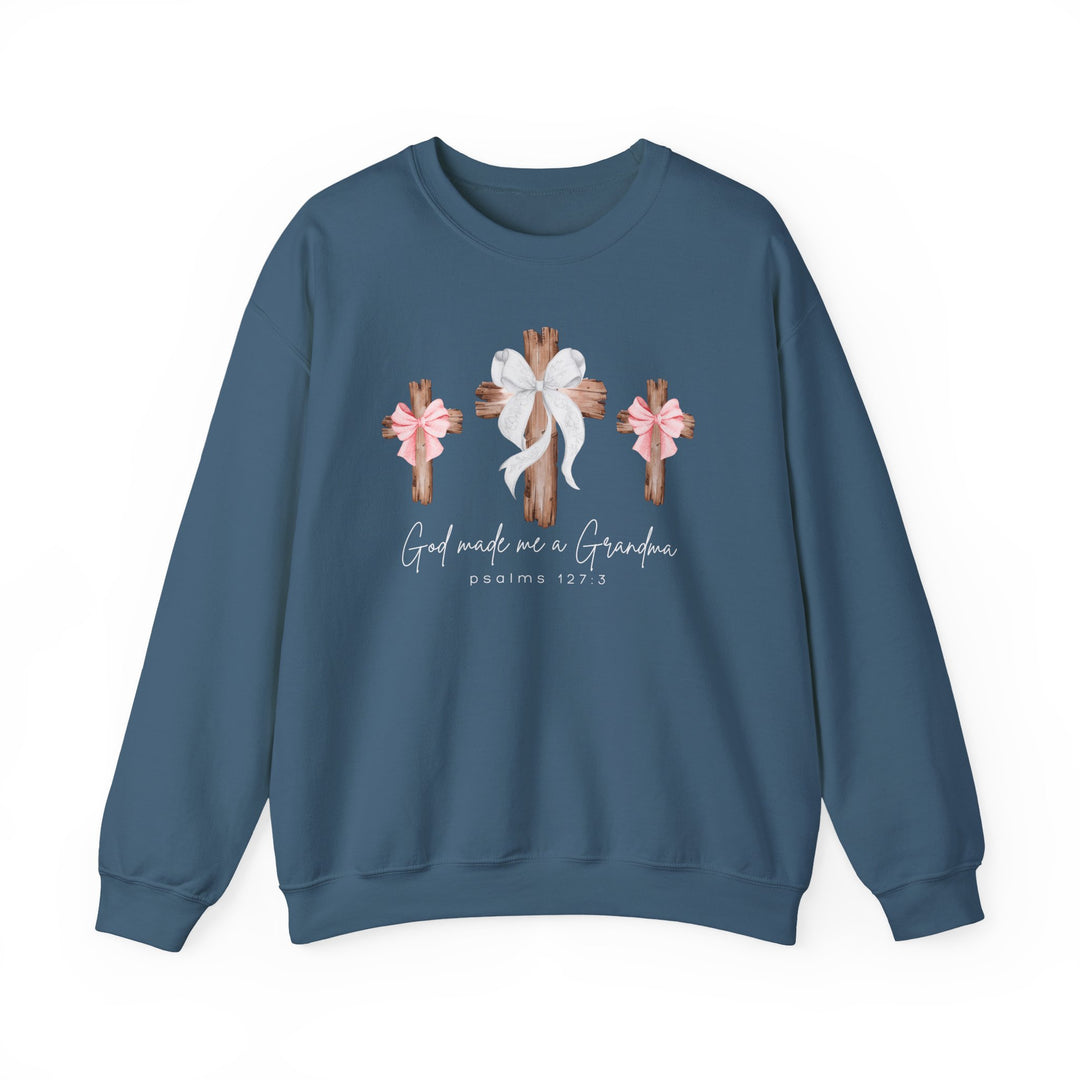 Blue crewneck sweatshirt with God Made Me a Girl Grandma Crew design featuring three rustic crosses and script text. Comfortable unisex fit, cotton-polyester blend.