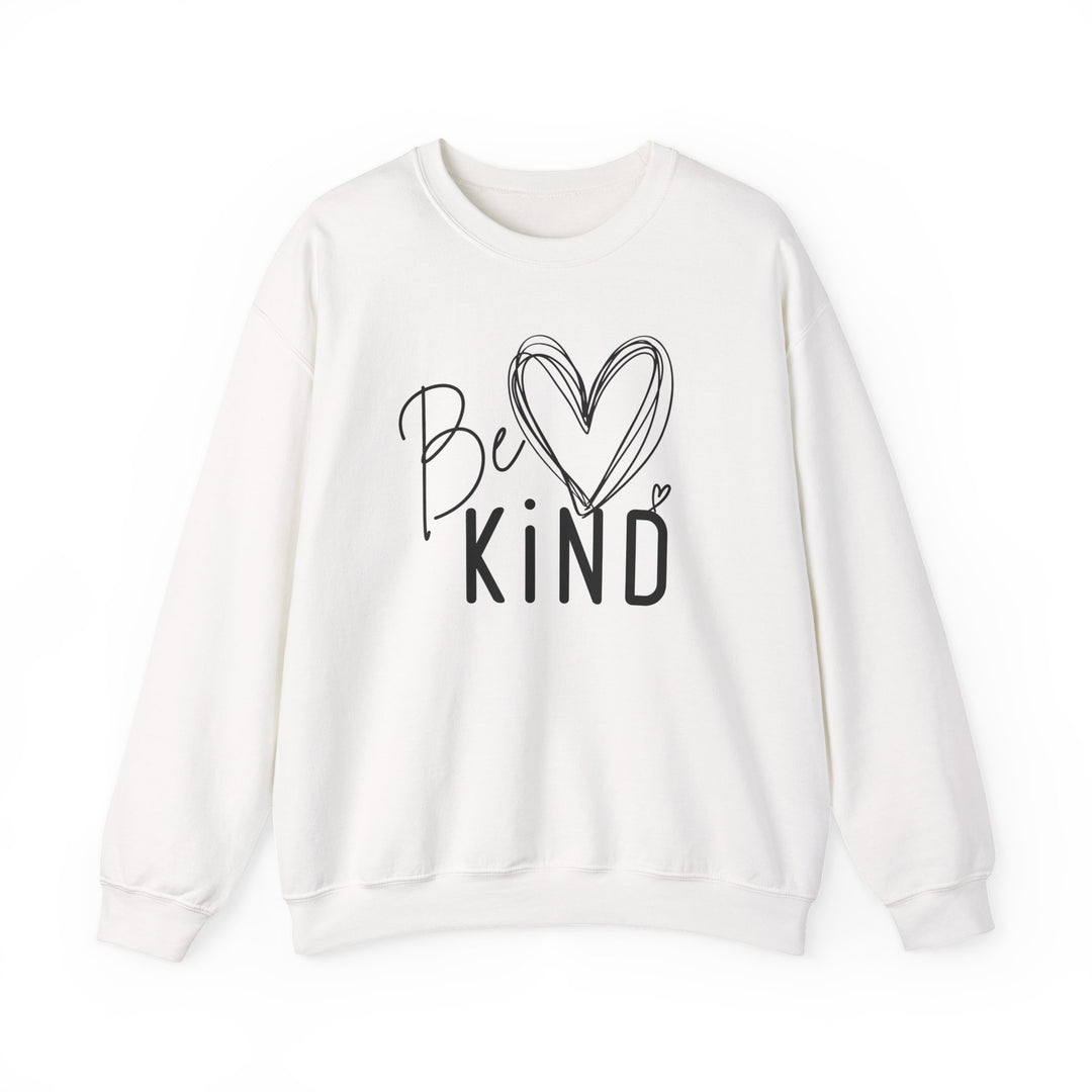 White long-sleeve crewneck sweatshirt with Be KIND graphic in black, featuring a hand-drawn heart. Part of Faith Family Designs' cozy, ethical collection.