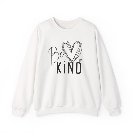 White long-sleeve crewneck sweatshirt with Be KIND graphic in black, featuring a hand-drawn heart. Part of Faith Family Designs' cozy, ethical collection.