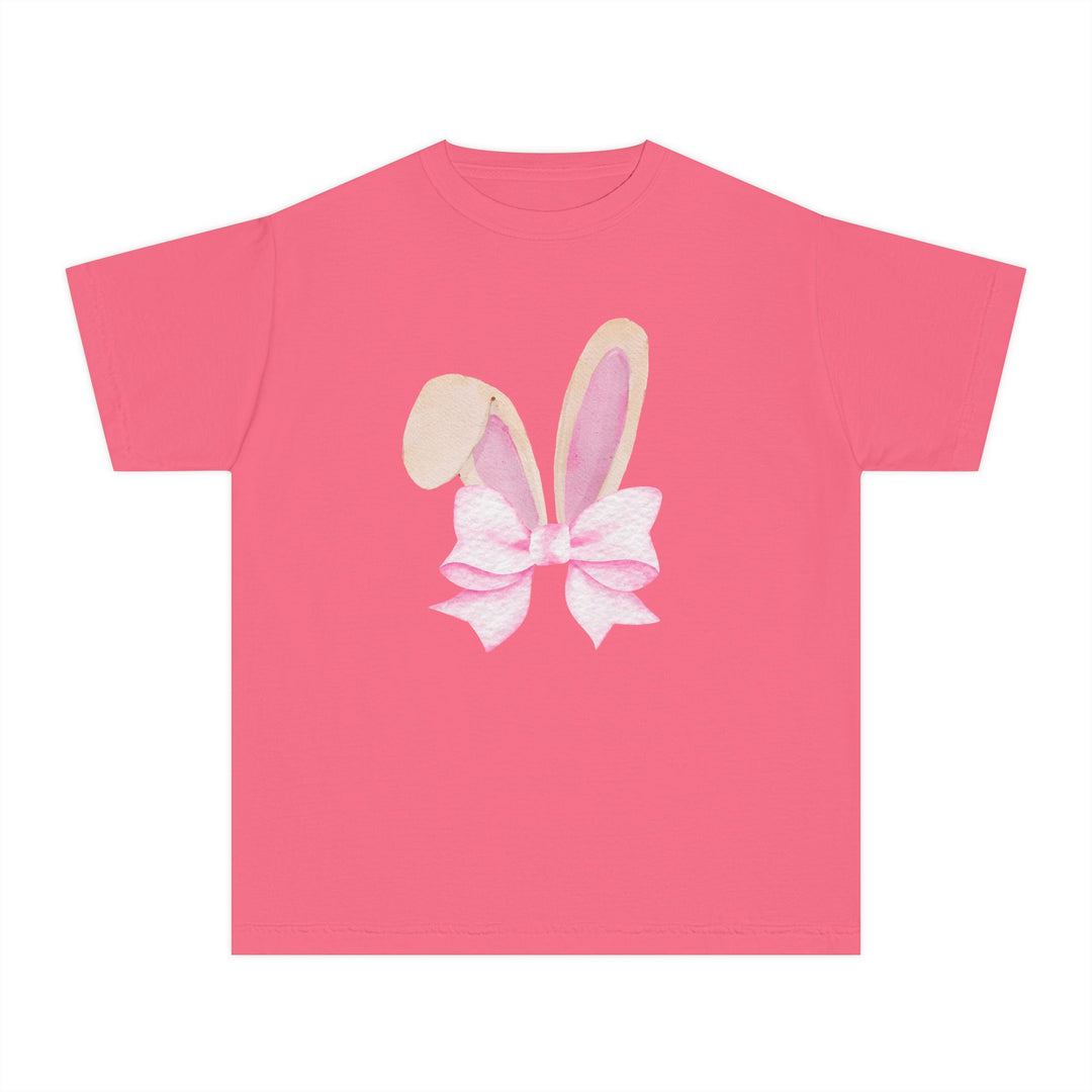 Bunny Bow Kids Tee: A plain pink T-shirt with watercolor-style bunny ears tied with a pale pink bow, designed for kid's comfort and daily wear.