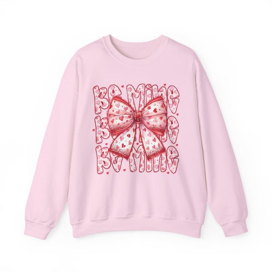 Be Mine Crew sweatshirt with a large red and pink heart-patterned bow and “BE MINE” text, designed for comfort with a polyester-cotton blend.