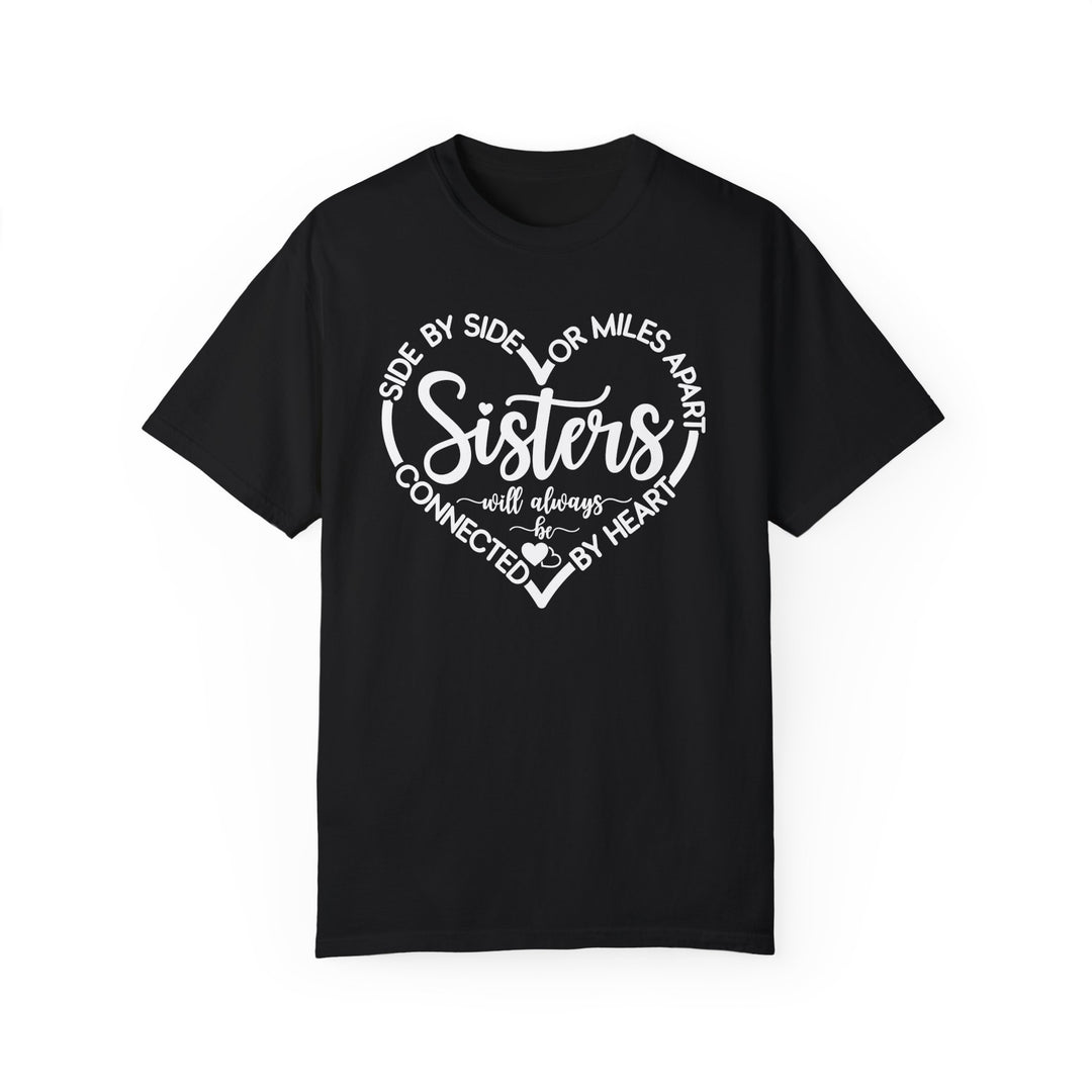 Sisters At Heart Tee: Black t-shirt with white text, made of 100% ring-spun cotton, featuring a relaxed fit and durable double-needle stitching.