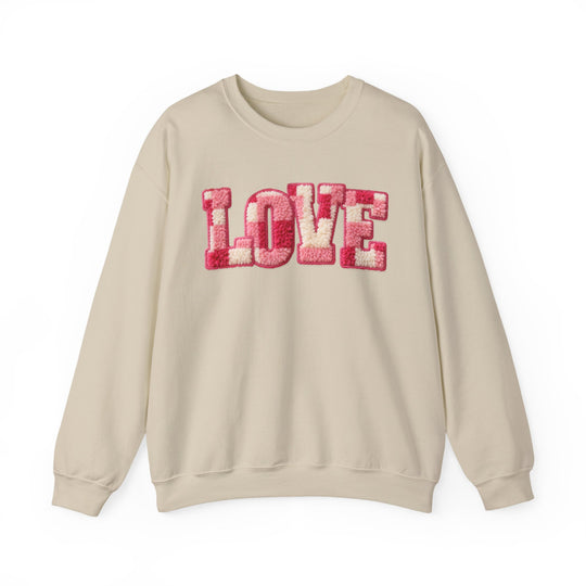 Love Crew sweatshirt with 'LOVE' in fuzzy pink and off-white patches, featuring a ribbed collar and loose fit, from Faith Family Designs.
