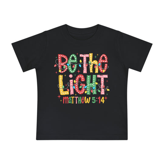 Be the Light Baby Tee: Black T-shirt featuring 'Both & Light' in colorful letters, cartoon Christmas lights, and 'Matthew 5:14' reference, perfect for stylish baby steps.