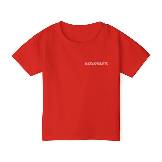 Heavy Cotton™ Toddler T-shirt, red with HEAVEN MADE in white on chest, offers comfort and eco-friendly style, crafted from 100% cotton for softness.