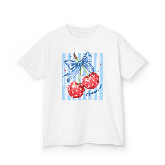American Cherry Kids Tee featuring red cherries with star patterns and a blue bow graphic, perfect for everyday wear with durable, soft cotton fabric.
