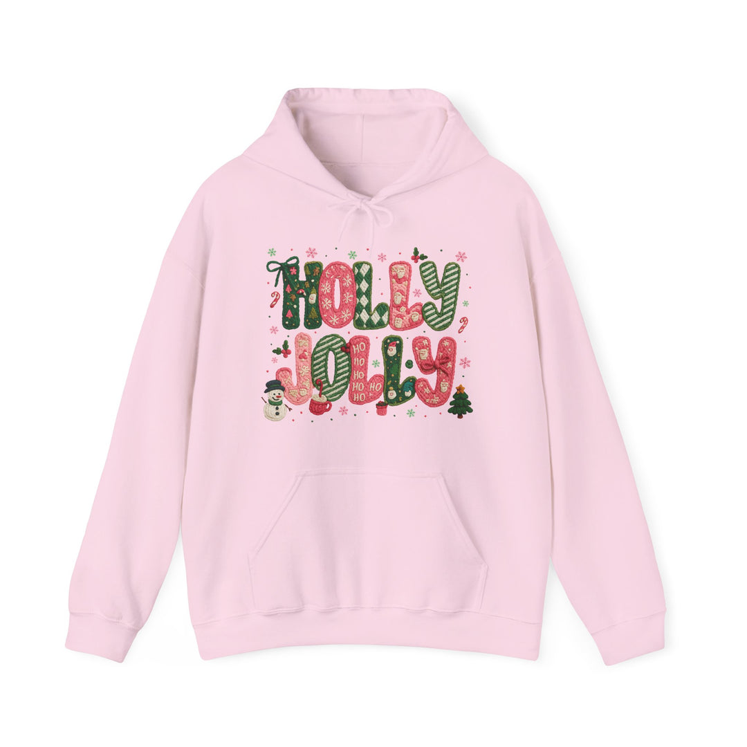 Holly Jolly Hoodie: Light-pink pullover with festive HOLLY JOLLY text, snowflakes, candy canes, snowman, and Christmas tree design. Cozy cotton-polyester blend with front pouch pocket.