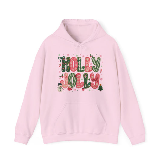 Holly Jolly Hoodie: Light-pink pullover with festive HOLLY JOLLY text, snowflakes, candy canes, snowman, and Christmas tree design. Cozy cotton-polyester blend with front pouch pocket.