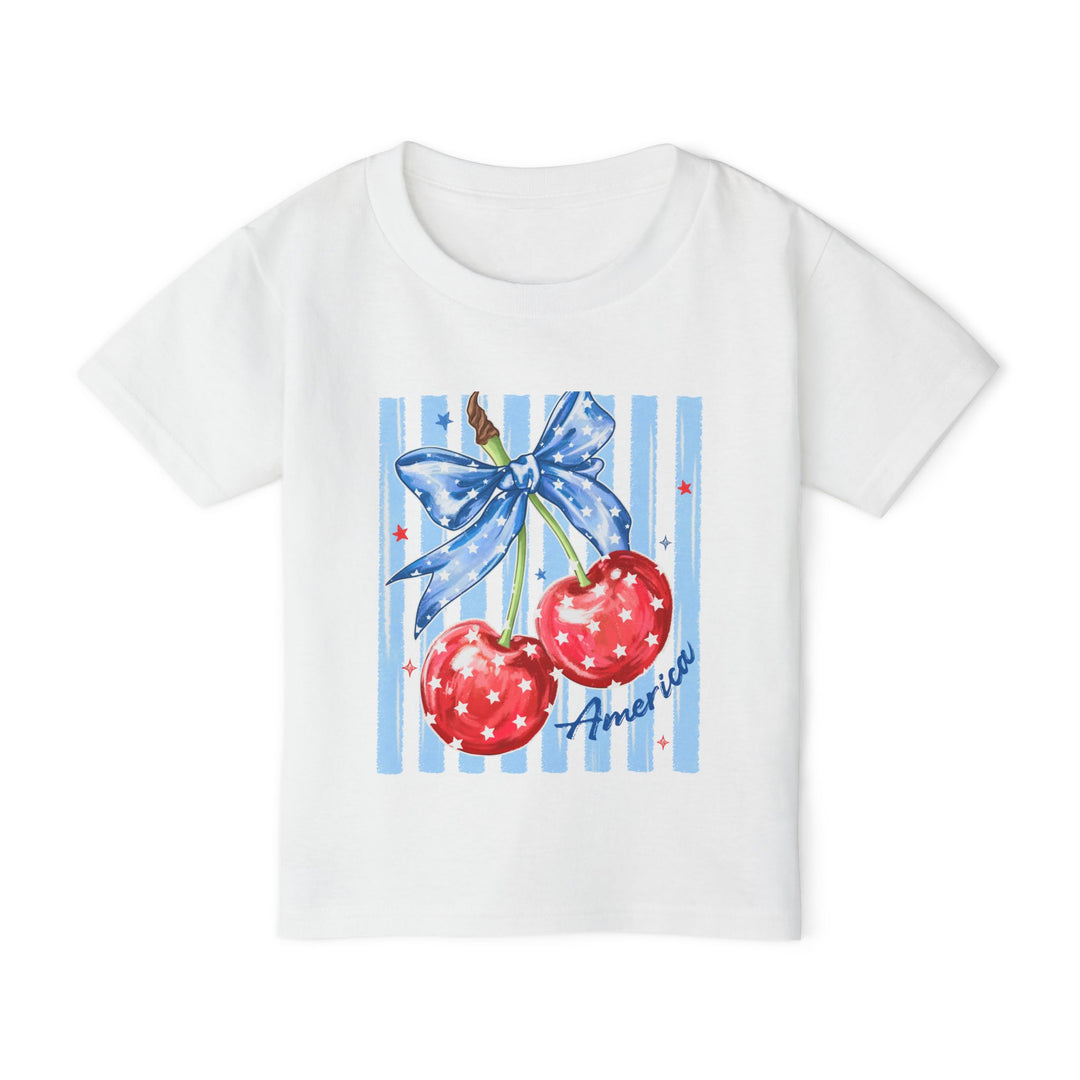 American Cherry Toddler Tee featuring a colorful Americana graphic with red cherries and blue ribbon, made from soft, eco-friendly cotton for stylish, comfortable wear.