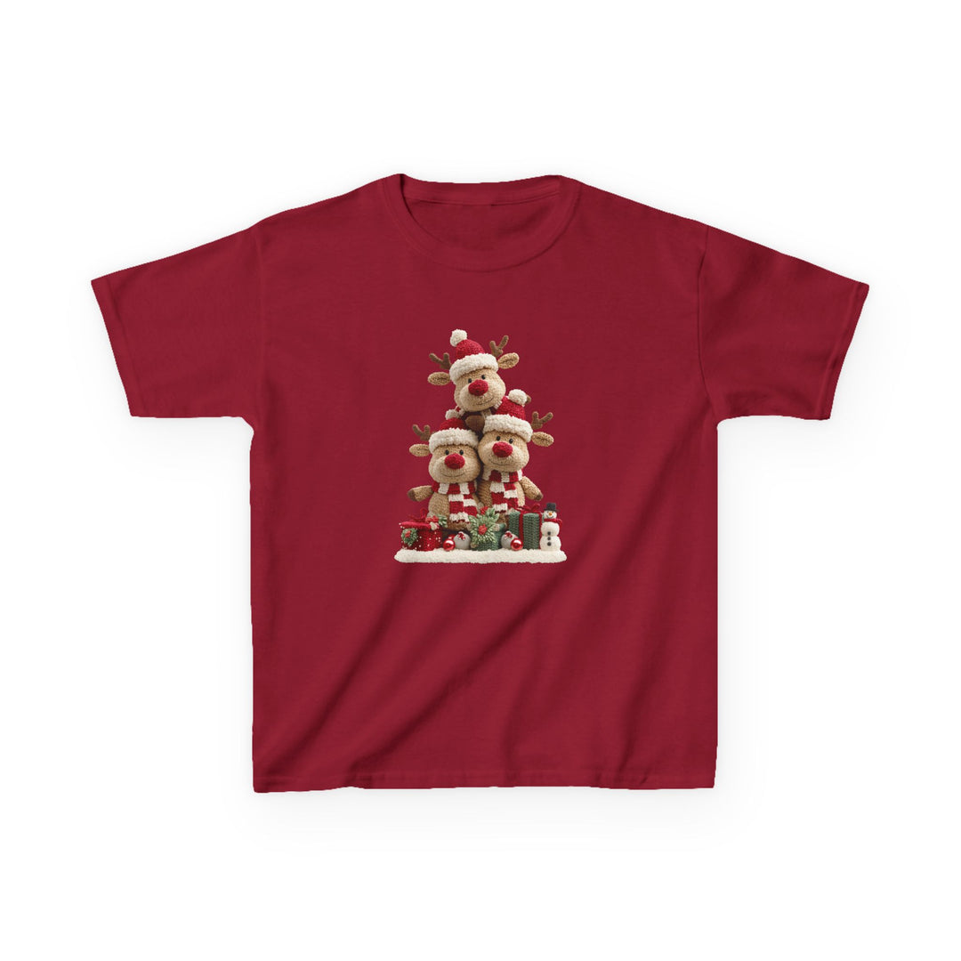 Reindeer Tree Kids Tee featuring three plush reindeer in festive attire, stacked pyramid-style on snow with gifts and a snowman, ideal for holiday wear.