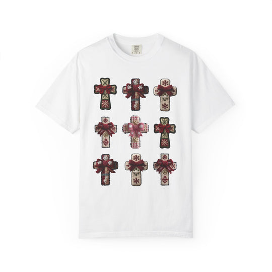 Crosses Tee: A white, crew-neck T-shirt featuring a 3x3 grid of ornament-style crosses with snowflake motifs and red ribbon bows.
