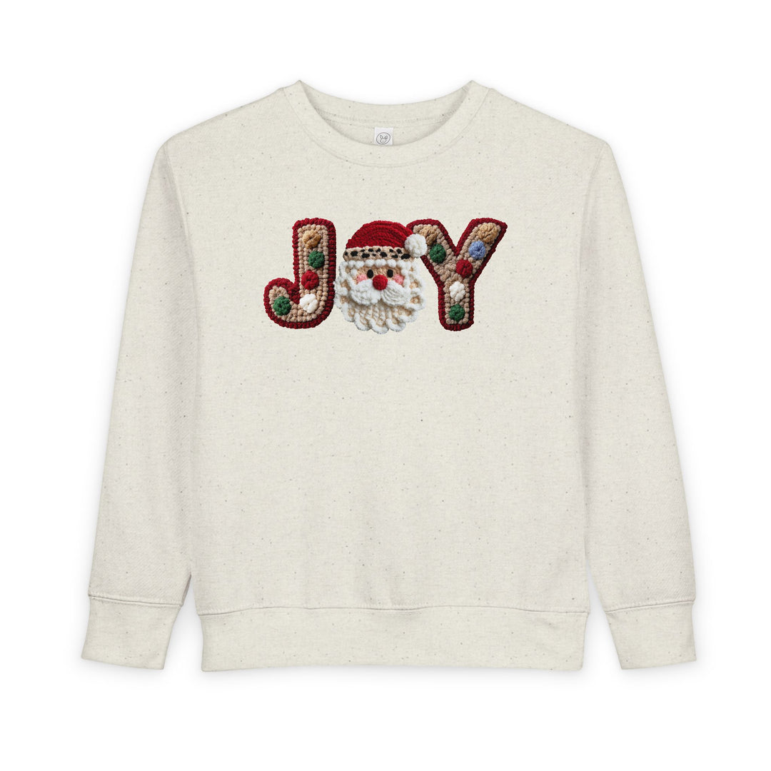 Joy Toddler Crew sweatshirt with JOY motif, featuring a crocheted Santa face for O, offers warmth and style for toddlers.