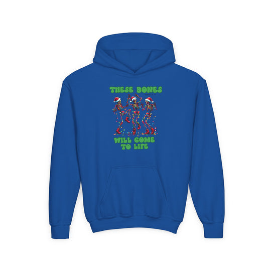 Youth hoodie featuring festive skeletons in Santa hats with Christmas lights, graphic text THESE BONES WILL COME TO LIFE, on royal-blue, ultra-soft fleece with kangaroo pocket.