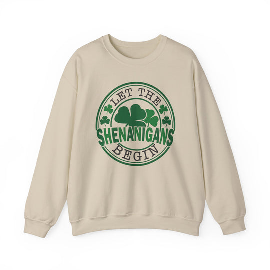 Let the Shenanigans Begin Day Crew sweatshirt with green circle and clover design, featuring ribbed collar and comfortable polyester-cotton blend.