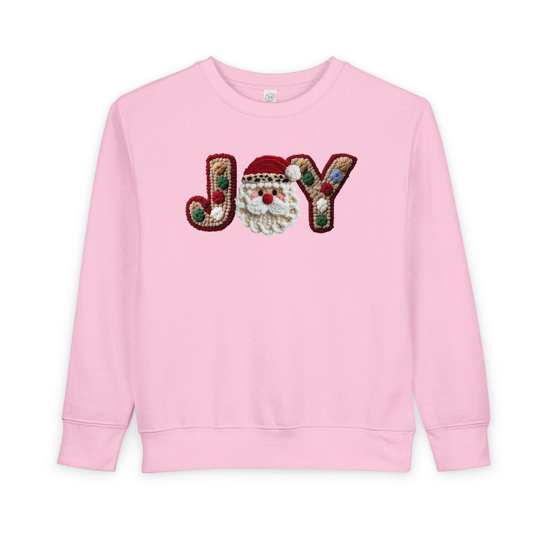 Joy Toddler Crew: Light-pink sweatshirt with JOY featuring tufted letters and a fluffy Santa face, ensuring warmth and style for toddlers.