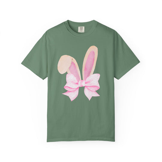 Green Bunny Bow Tree Tee with a watercolor graphic of bunny ears and a pink bow on front, offering a relaxed fit and comfortable wear.