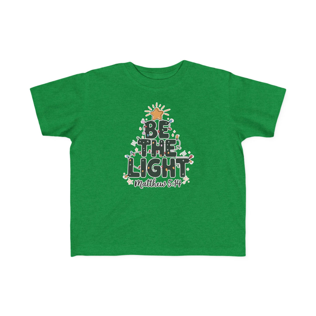 Green Be the Light toddler tee with a Christmas tree graphic and Bible reference, designed for comfort and durability.