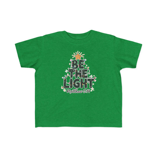 Green Be the Light toddler tee with a Christmas tree graphic and Bible reference, designed for comfort and durability.
