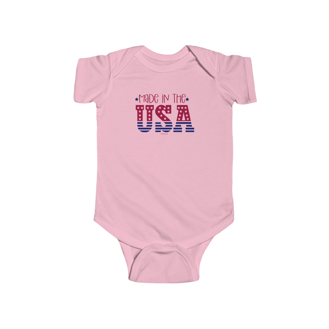 Made in the USA Onesie by Worlds Worst Tees, a pink baby bodysuit with red and blue text. 100% cotton, light fabric, ribbed knitting for durability, plastic snaps for easy changing access.