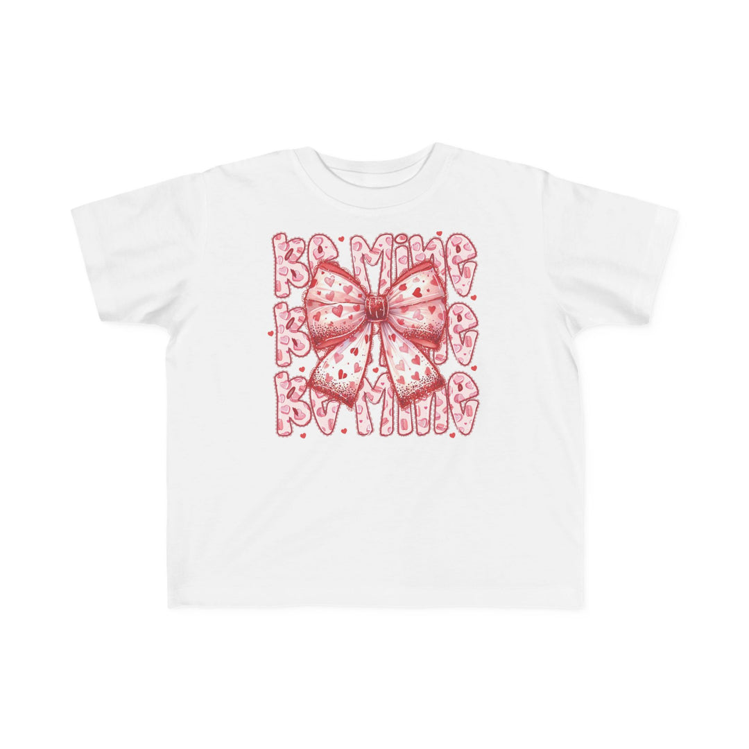 Be Mine Toddler Tee with a pink bow and red hearts, perfect for sensitive skin, featuring Be Mine text in a bubbly font.