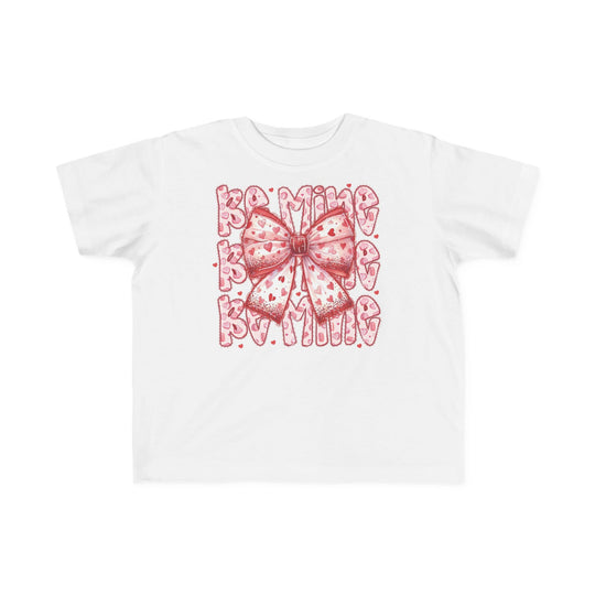 Be Mine Toddler Tee with a pink bow and red hearts, perfect for sensitive skin, featuring Be Mine text in a bubbly font.