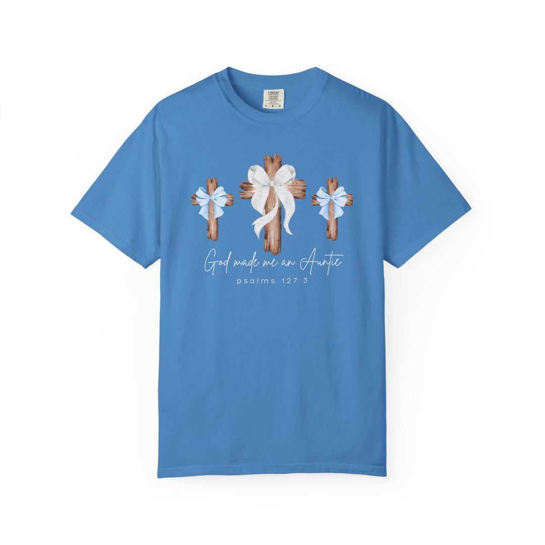 Cornflower-blue “God Made Me a Boy Auntie Tee” with rustic wooden crosses, bows, and script-style text. Comfortable, durable, garment-dyed 100% cotton. Available in multiple sizes.