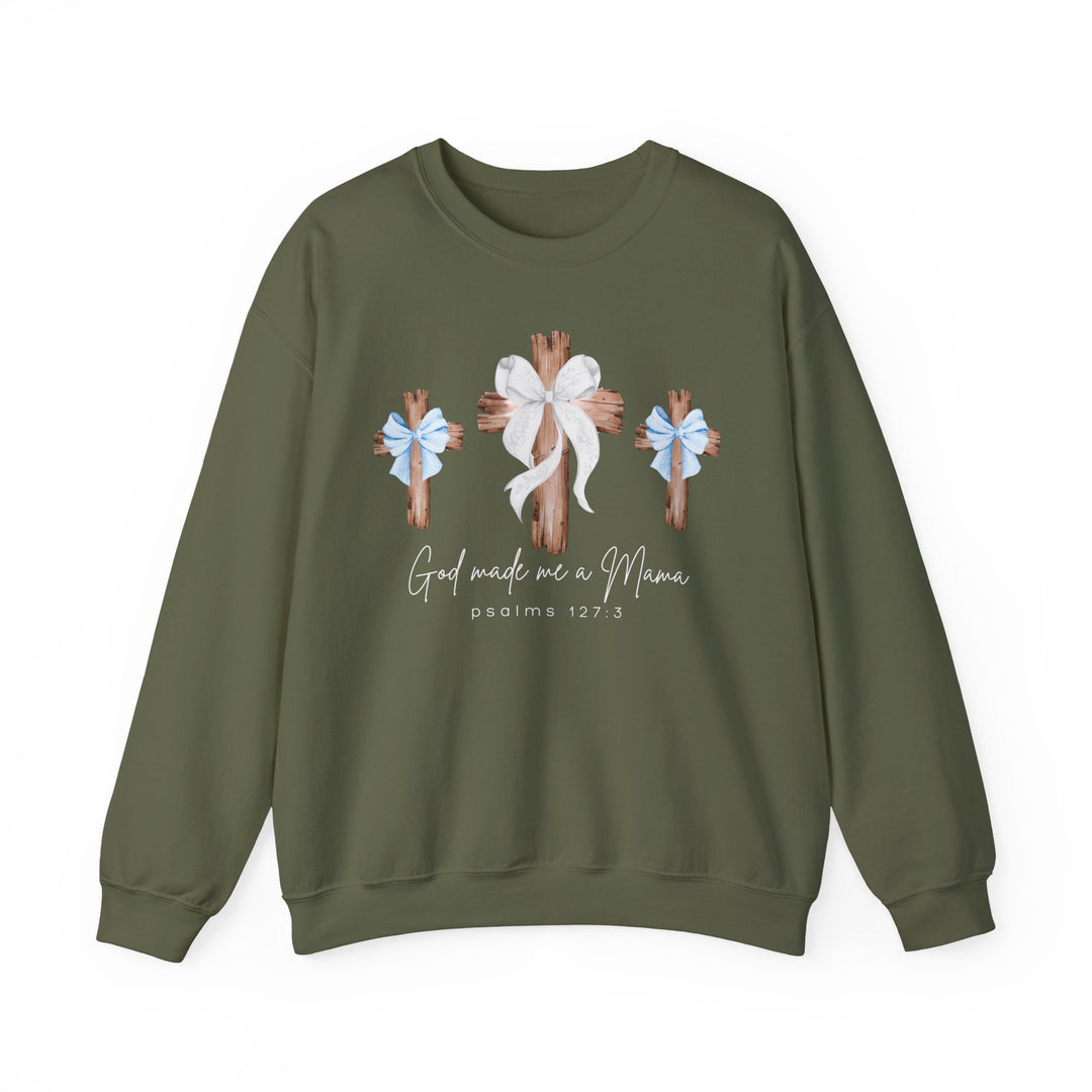 God Made Me a Boy Mama Crew: Olive-green sweatshirt with rustic wooden crosses and script text, combining comfort with faith and family-themed design.