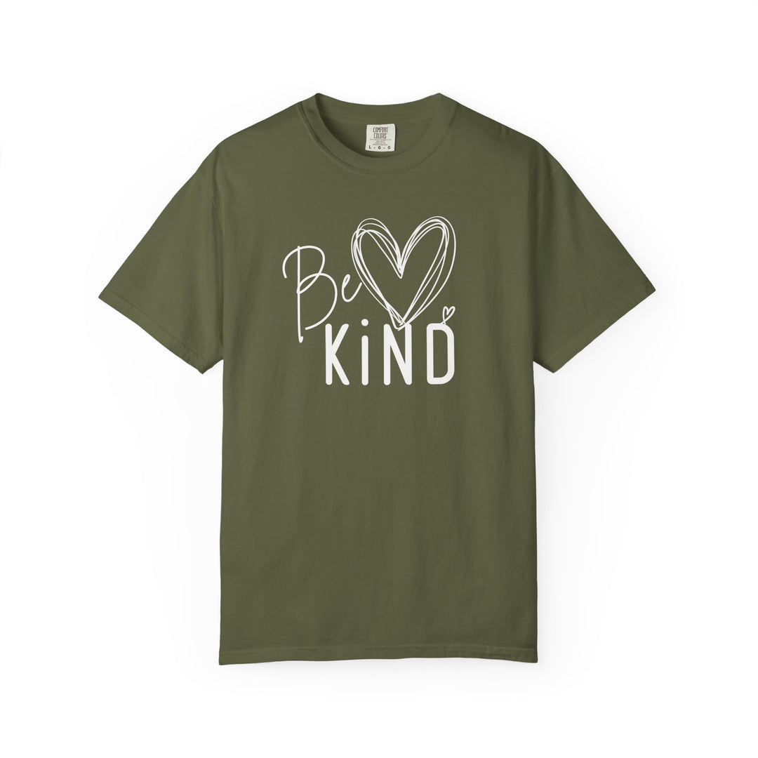 Olive green 'Be Kind' T-shirt featuring a cursive and block letter design with heart accents, emphasizing kindness in trendy, casual style.