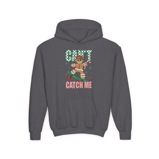 Can't Catch Me Youth Hoodie features a cartoon gingerbread man skateboarding with a candy cane, wearing a cap, surrounded by CAN’T CATCH ME in festive lettering.
