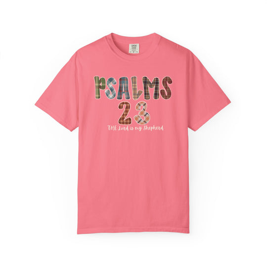 Coral-pink Psalms 23 Tee featuring a plaid patchwork graphic and script. Luxurious comfort with a relaxed fit, perfect for expressing faith and style.