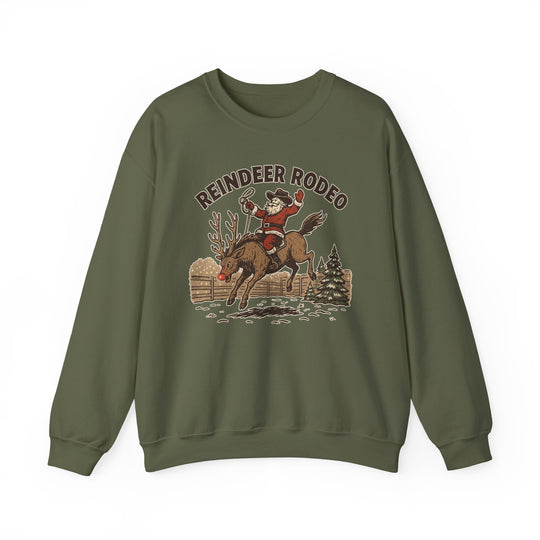 Reindeer Rodeo Crew: Olive-green sweatshirt featuring Santa riding a reindeer in a cowboy theme. Cozy, durable, ideal for cold weather, and perfect for unique graphic t-shirt lovers.