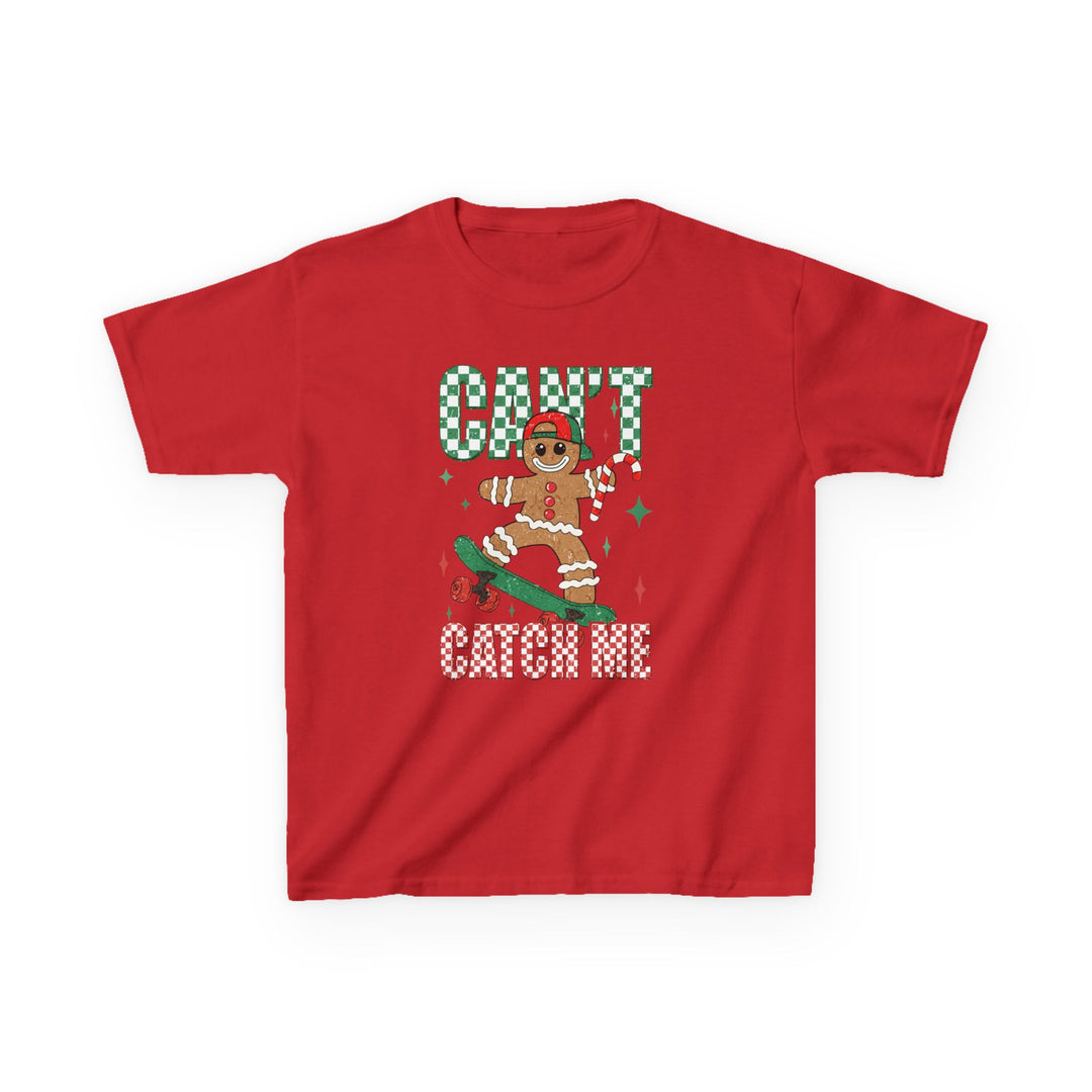 Can't Catch Me Kids Tee featuring a gingerbread on skateboard with candy-cane, festive sparkles, and checkerboard text. Durable, soft cotton, perfect for everyday wear.