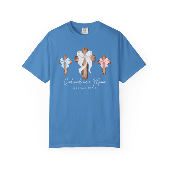 Sky-blue God Made Me a Mama tee with three rustic wooden crosses, featuring bows and Psalm 127:3 text, offering comfort and a relaxed fit.