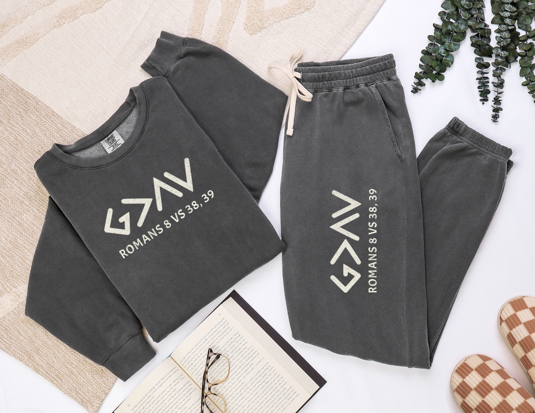 God is Greater Sweatpants featuring grey, relaxed fit, made from American-sourced ring-spun cotton, garment-dyed for a vintage look, with white text detail.