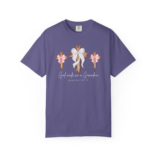 Purple T-shirt featuring three rustic wooden crosses with bows, text God made me a Grandma, and Psalms 127:3, capturing a heartfelt, faith-centered design.