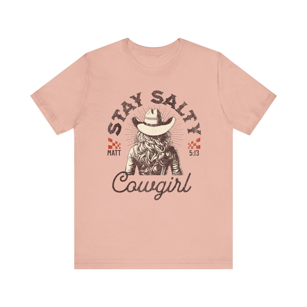 Stay Salty Tee: Pink short sleeve t-shirt featuring a cowboy hat and cowgirl graphic. Soft cotton fabric with ribbed knit collars for lasting shape.