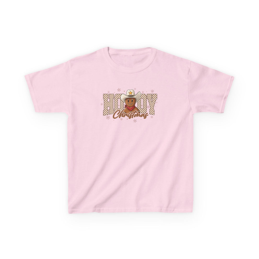 Howdy Christmas Kids Tee: Light-pink T-shirt with “HOWDY Christmas” graphic, featuring a gingerbread face cowboy motif and snowflakes. Perfect for everyday wear, made from durable, soft cotton.