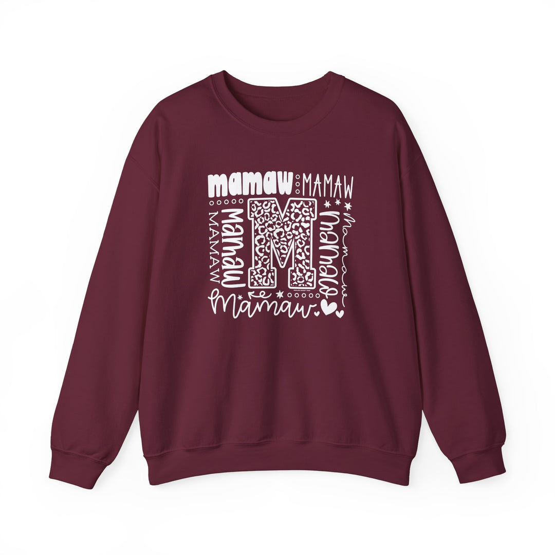 A unisex Mamaw Crew heavy blend sweatshirt in maroon with white letters. Features ribbed knit collar, no itchy side seams, and durable double-needle stitching. Made from 50% cotton, 50% polyester fabric blend.