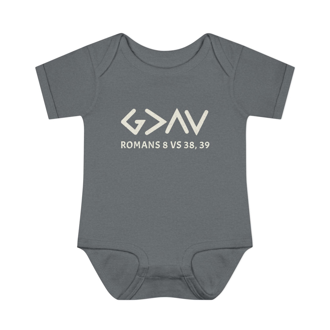 Grey baby bodysuit with God is Greater in white text, featuring lap shoulders and made from soft, 100% combed ringspun cotton for infant comfort.