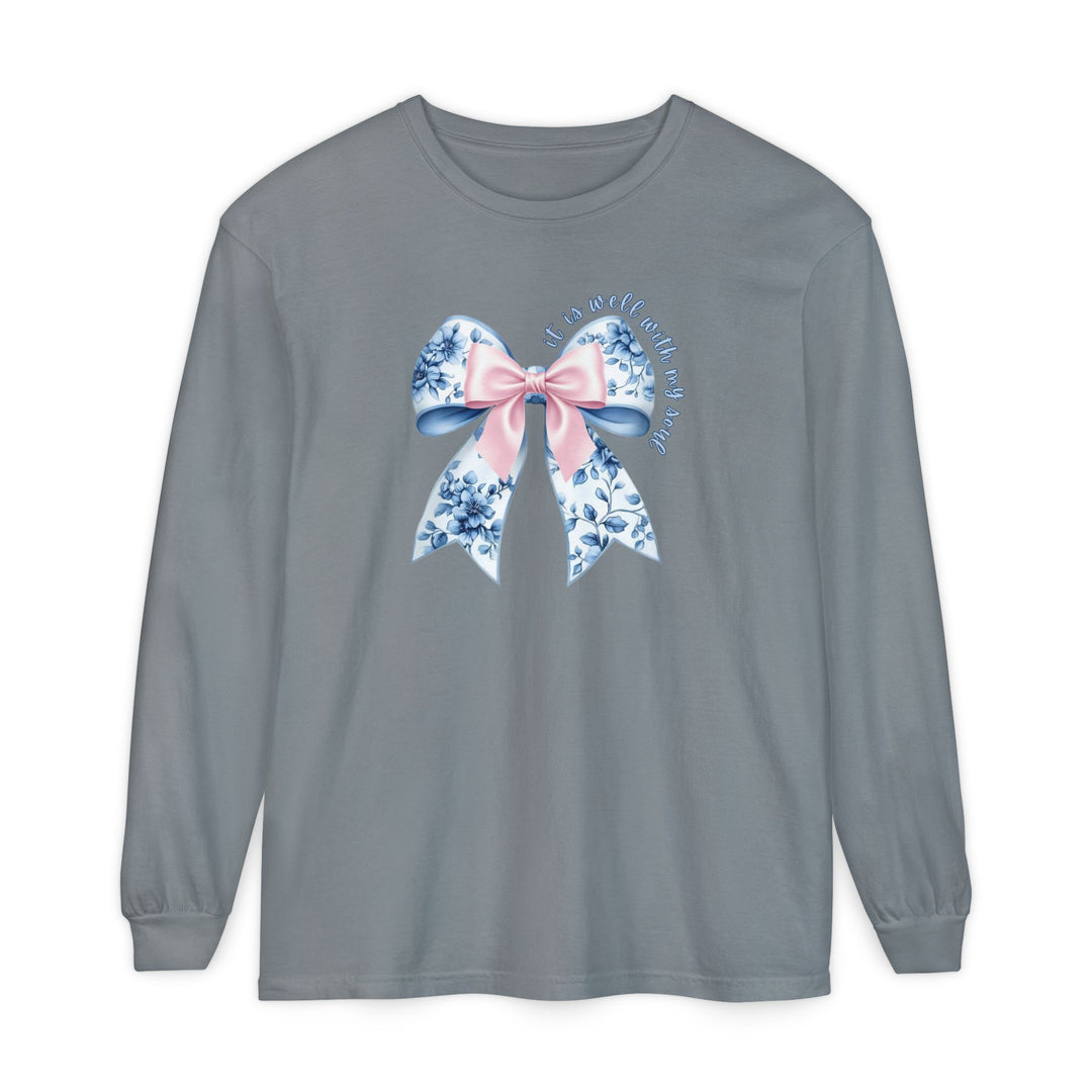 It is Well With My Soul Long Sleeve Tee featuring a floral and pink bow graphic on a heather-gray background, offering a relaxed, comfortable fit.