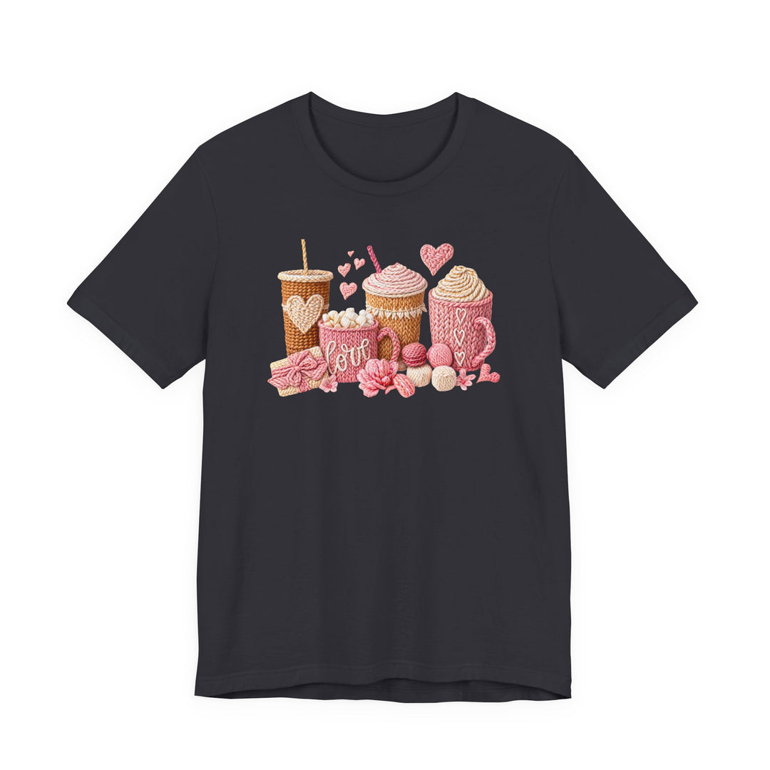 Coffee Love Tee featuring knit-look graphics of drinks, yarn, and hearts on a charcoal T-shirt, offering cozy vibes with a soft, comfortable fit.