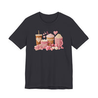 Coffee Love Tee featuring knit-look graphics of drinks, yarn, and hearts on a charcoal T-shirt, offering cozy vibes with a soft, comfortable fit.