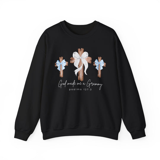 Black crewneck sweatshirt featuring three wooden crosses with bows, and the phrase “God made me a Grammy.” Ideal for comfort, loose fit, polyester-cotton blend.