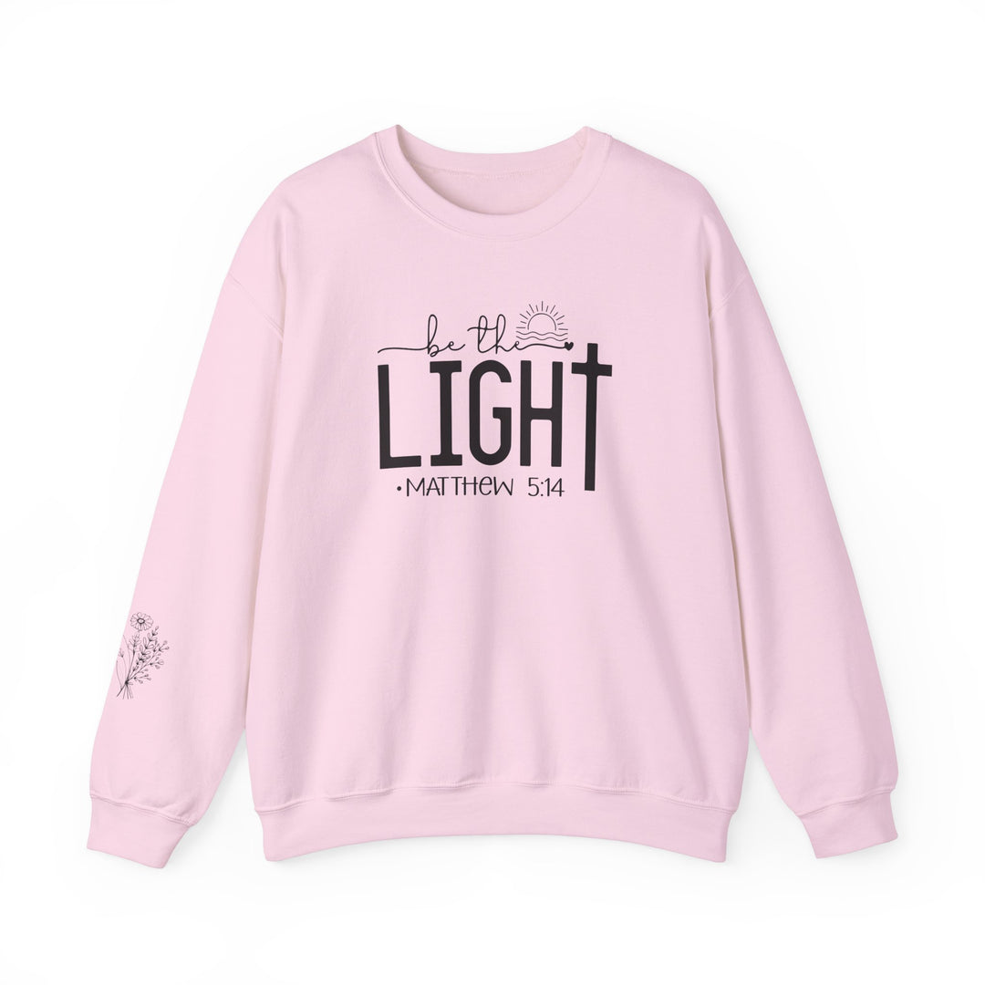 A unisex heavy blend crewneck sweatshirt, the Be the Light Crew, offers comfort and durability. Made of 50% cotton and 50% polyester, featuring a ribbed knit collar and double-needle stitching for a classic fit.