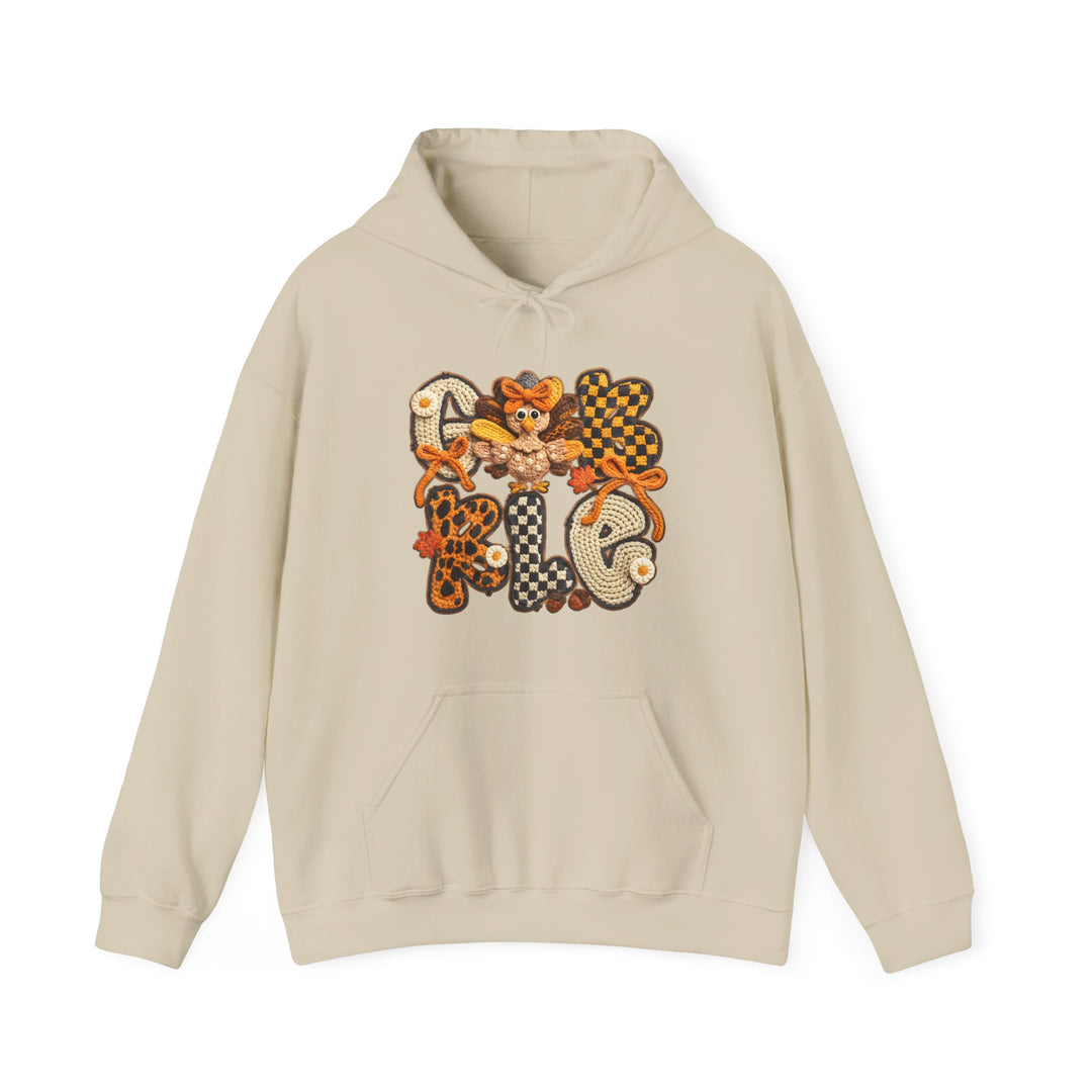 Light-beige Gobble Hoodie featuring whimsical Thanksgiving design with GOBBLE in autumnal colors, cartoon turkey in O, kangaroo pocket, drawstring hood.