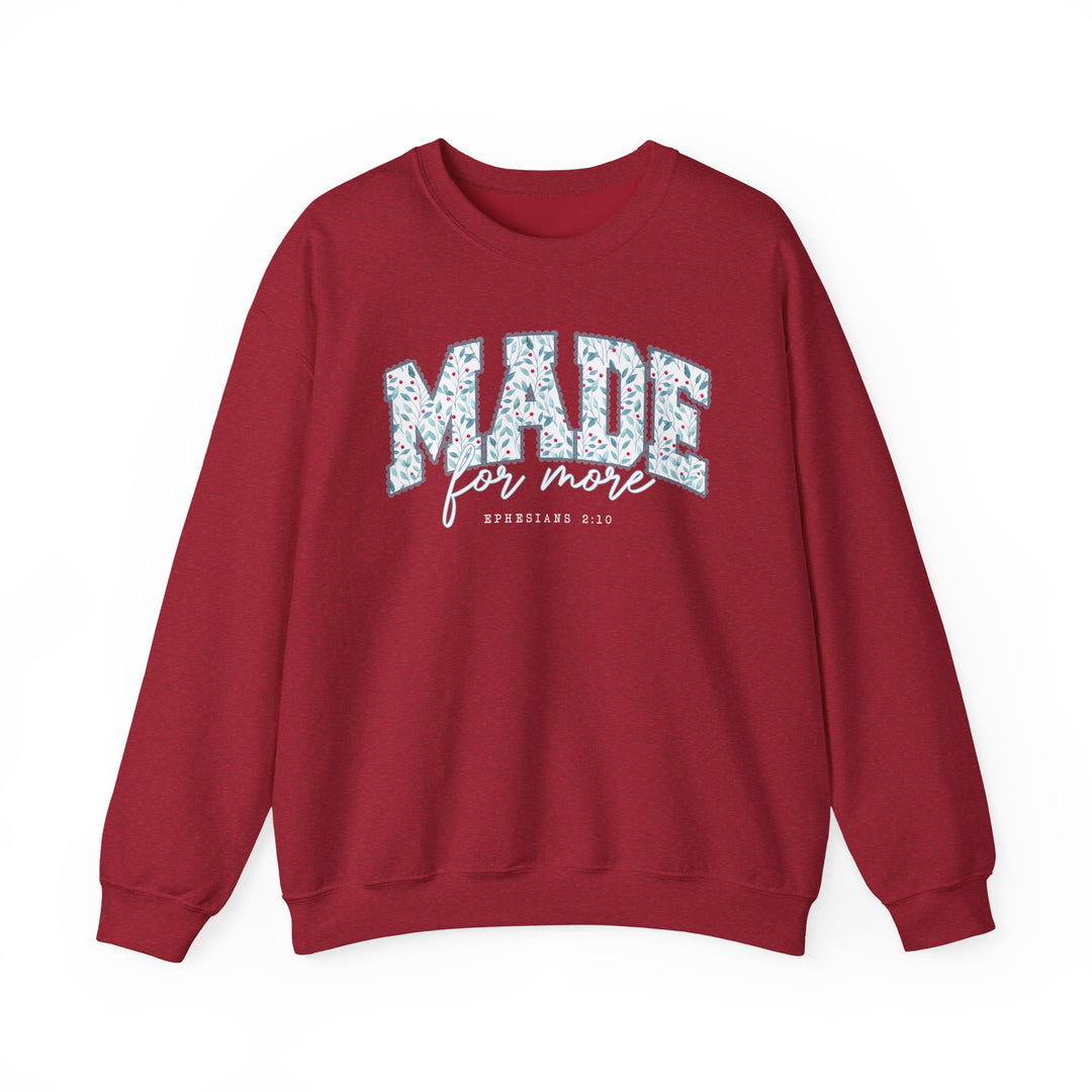 Deep red Made for More Crew sweatshirt with a leafy graphic design and biblical reference on chest, featuring a comfortable, loose fit ideal for casual wear.